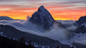 A photo of a mountain at sunset.