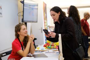 2019 CC Global Summit volunteer helping a participant