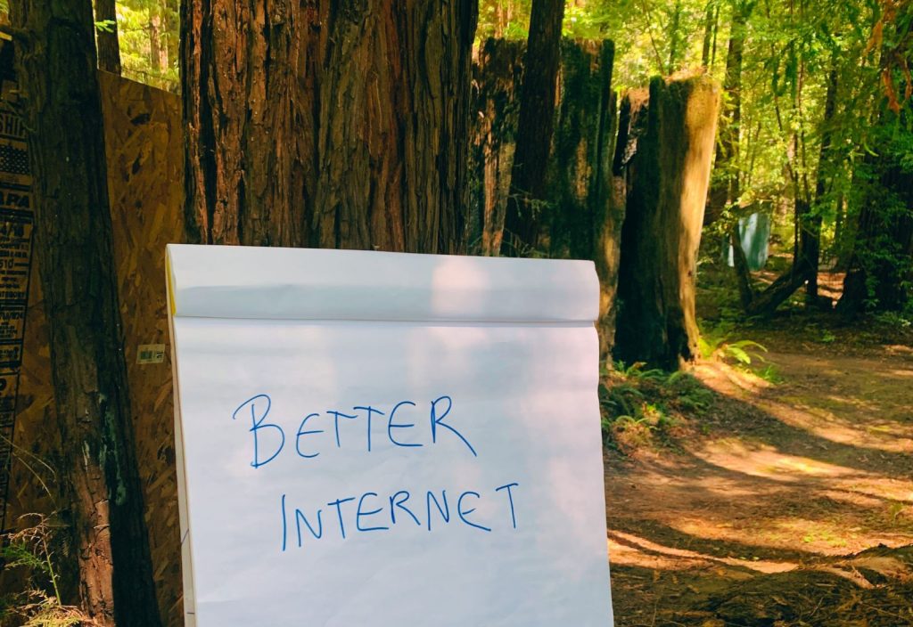 Photo of flipchart with the words "Better Internet" on it from Dweb Camp, decentralized web conference at Camp Navarro, Navarro, CA