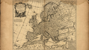 An old open book showing a map of Europe.
