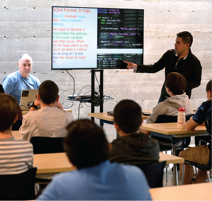 A staff sergeant holds a cyber certification training course for youth